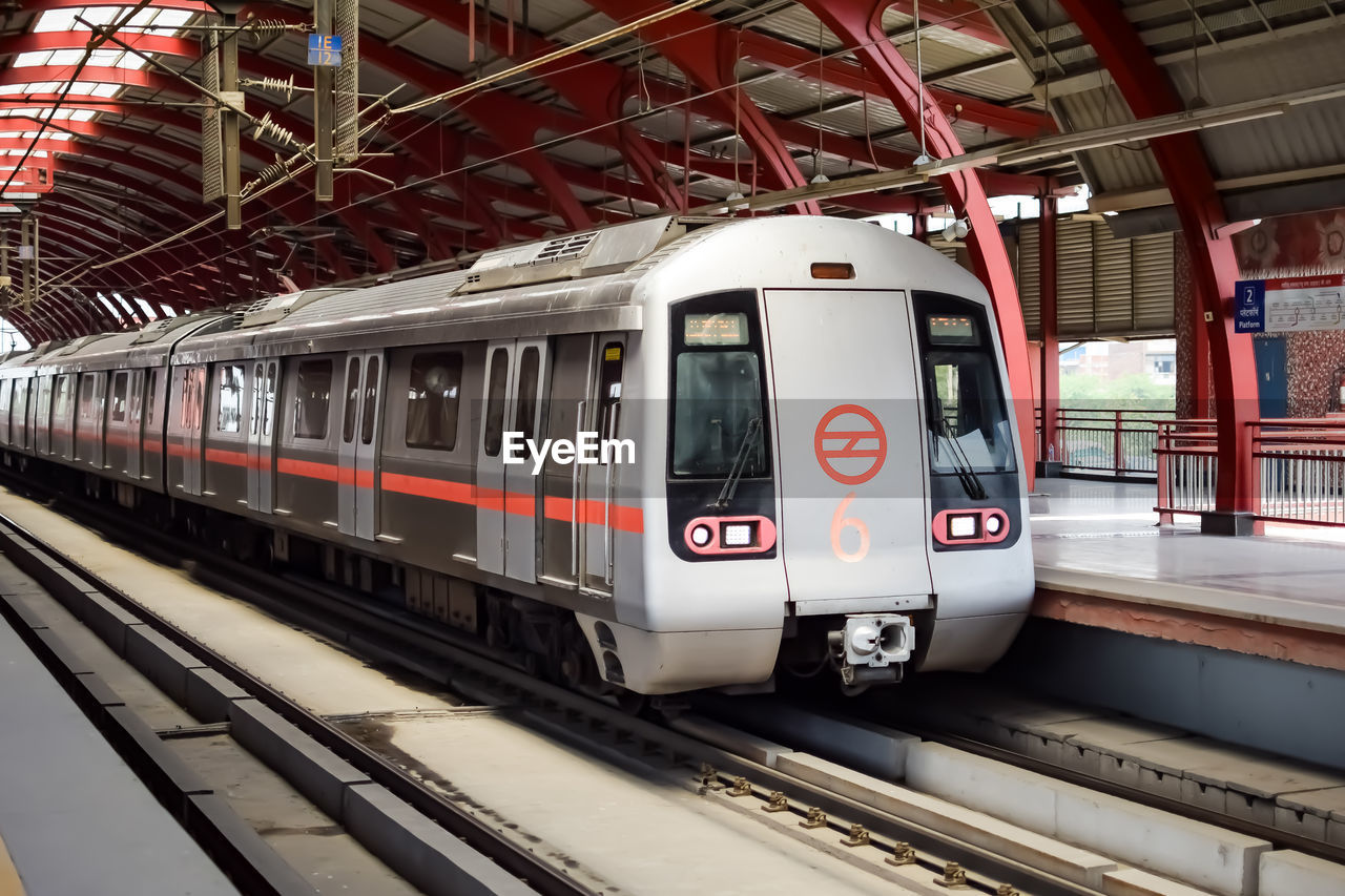 Delhi metro train arriving at jhandewalan metro station in new delhi, india,asia, public metro train