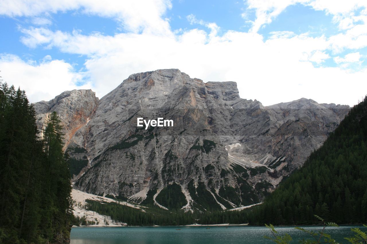 Scenic view of lake and mountains against sky