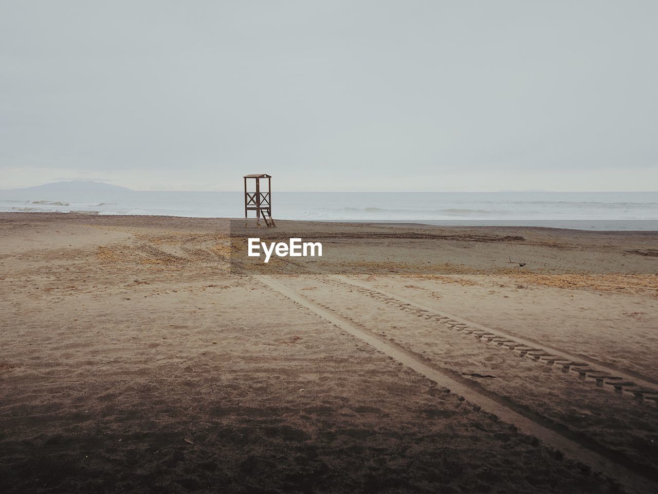 Scenic view of beach against clear sky