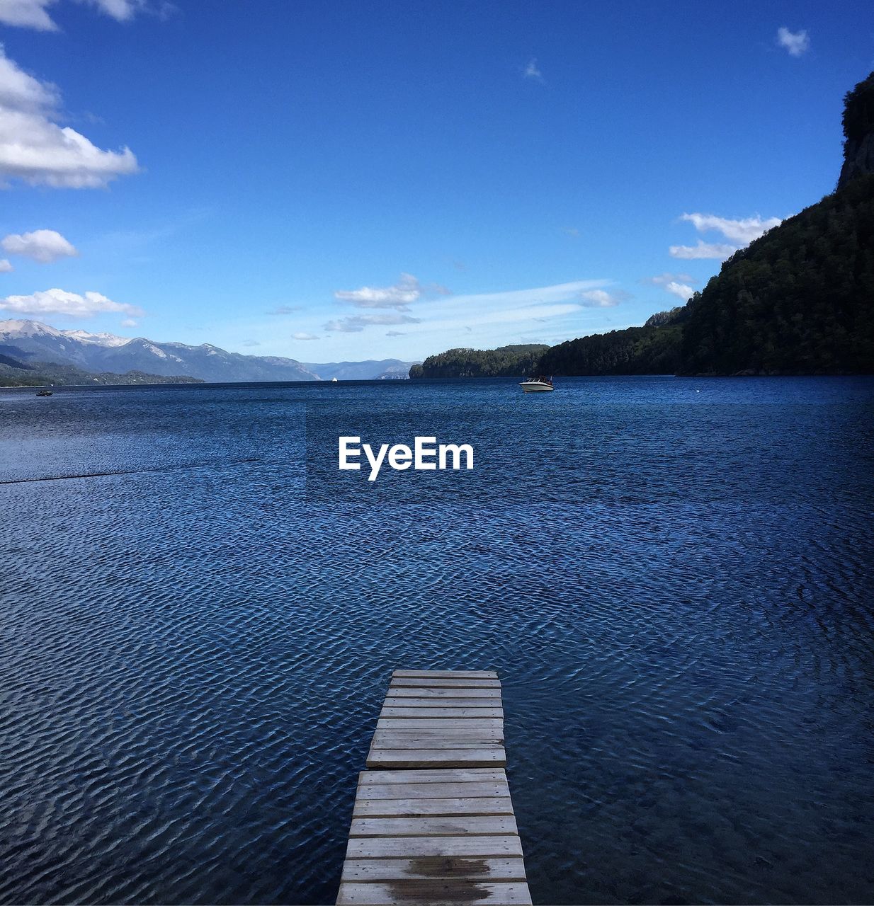 Scenic view of sea against blue sky