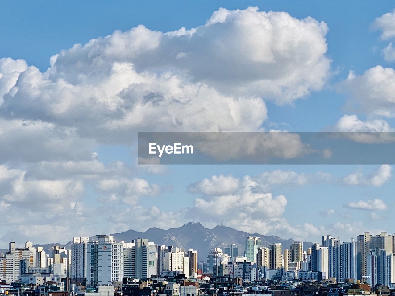 Modern buildings in city against sky