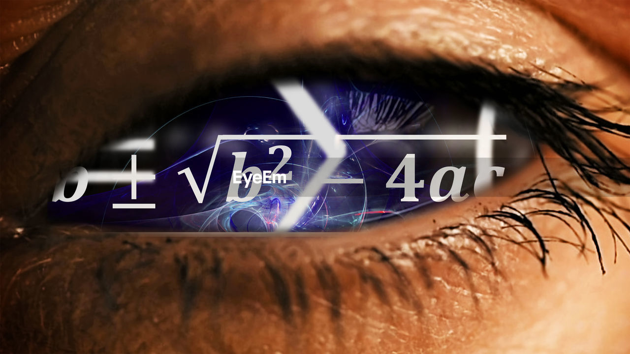 CLOSE-UP OF TEXT ON HUMAN EYE