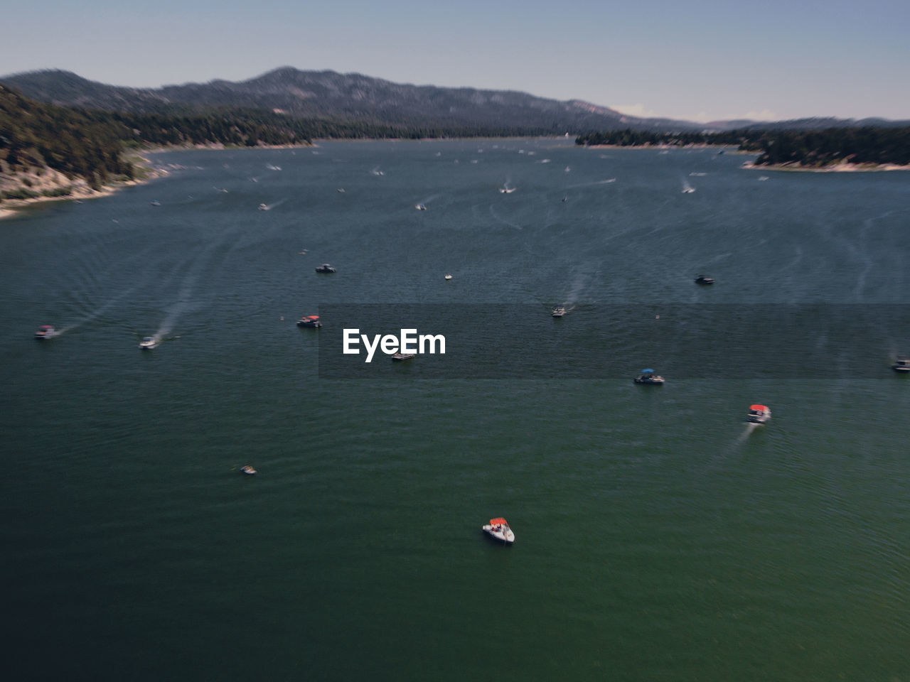 HIGH ANGLE VIEW OF PEOPLE IN SEA