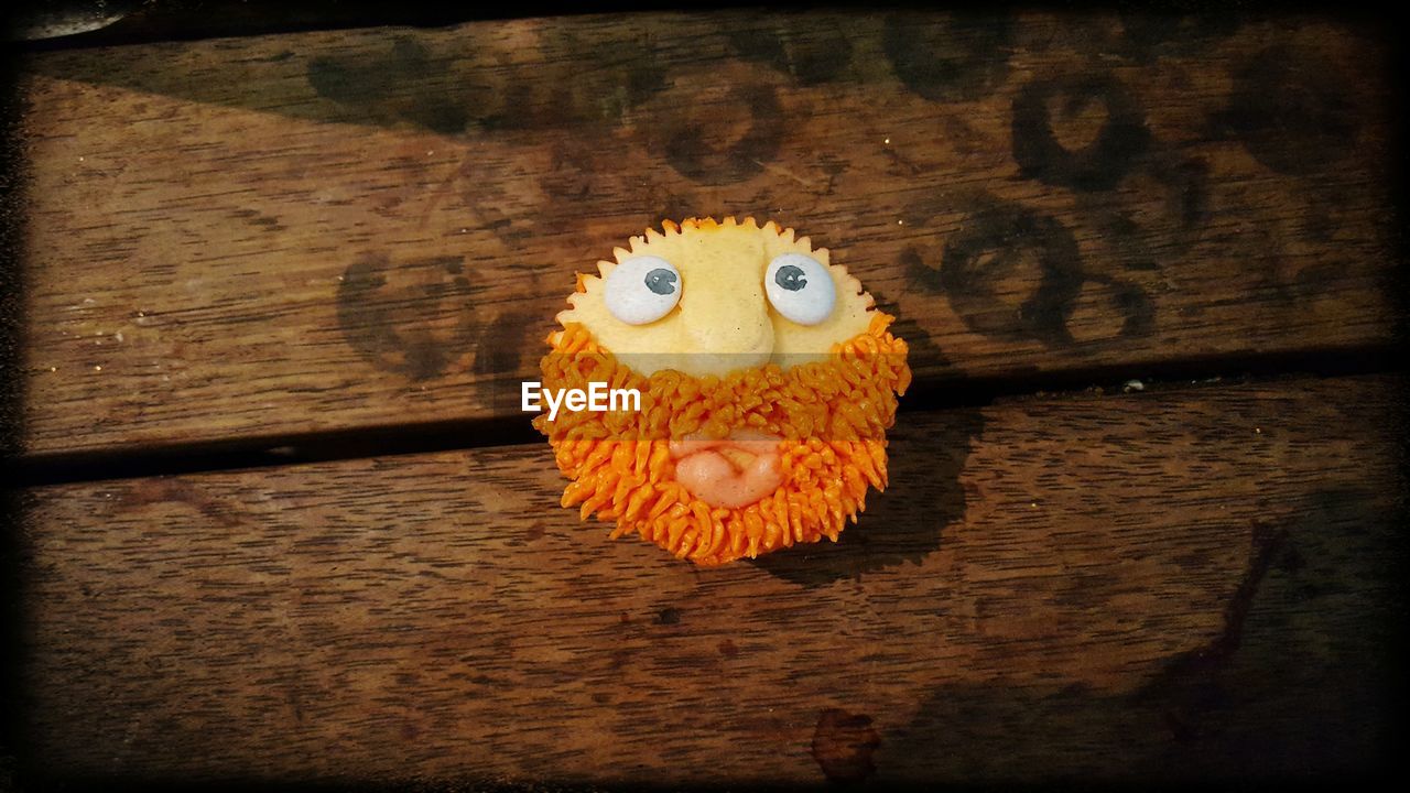 CLOSE-UP OF TOY ON TABLE AT HOME