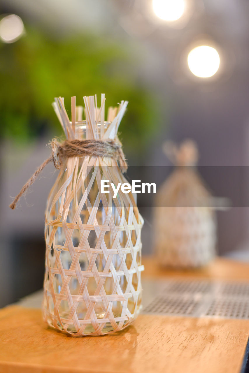 Small wicker round bamboo basket decoration on the table. portrait size