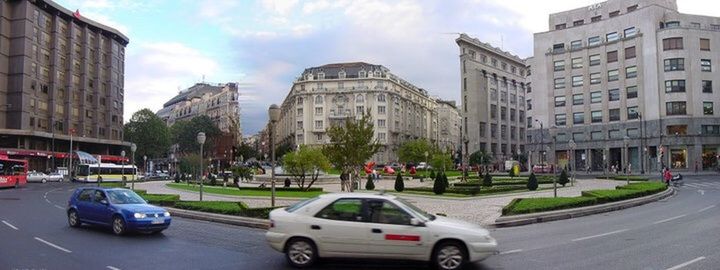 CITY STREET AGAINST SKY