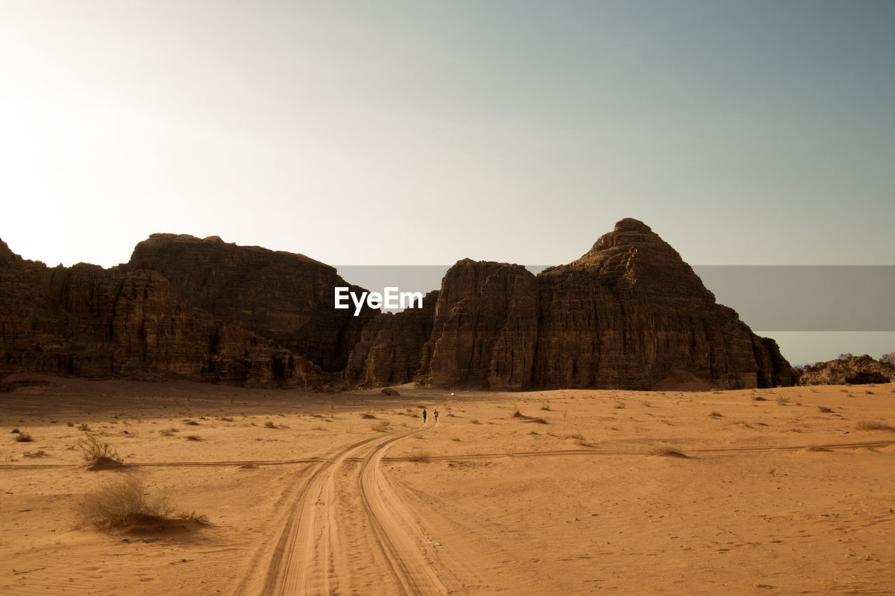 Scenic view of desert against clear sky