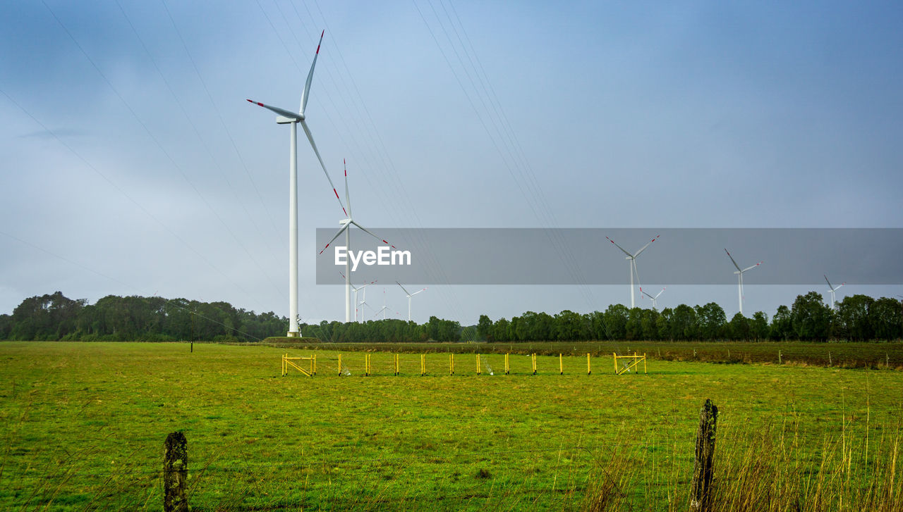 WIND TURBINES IN FIELD