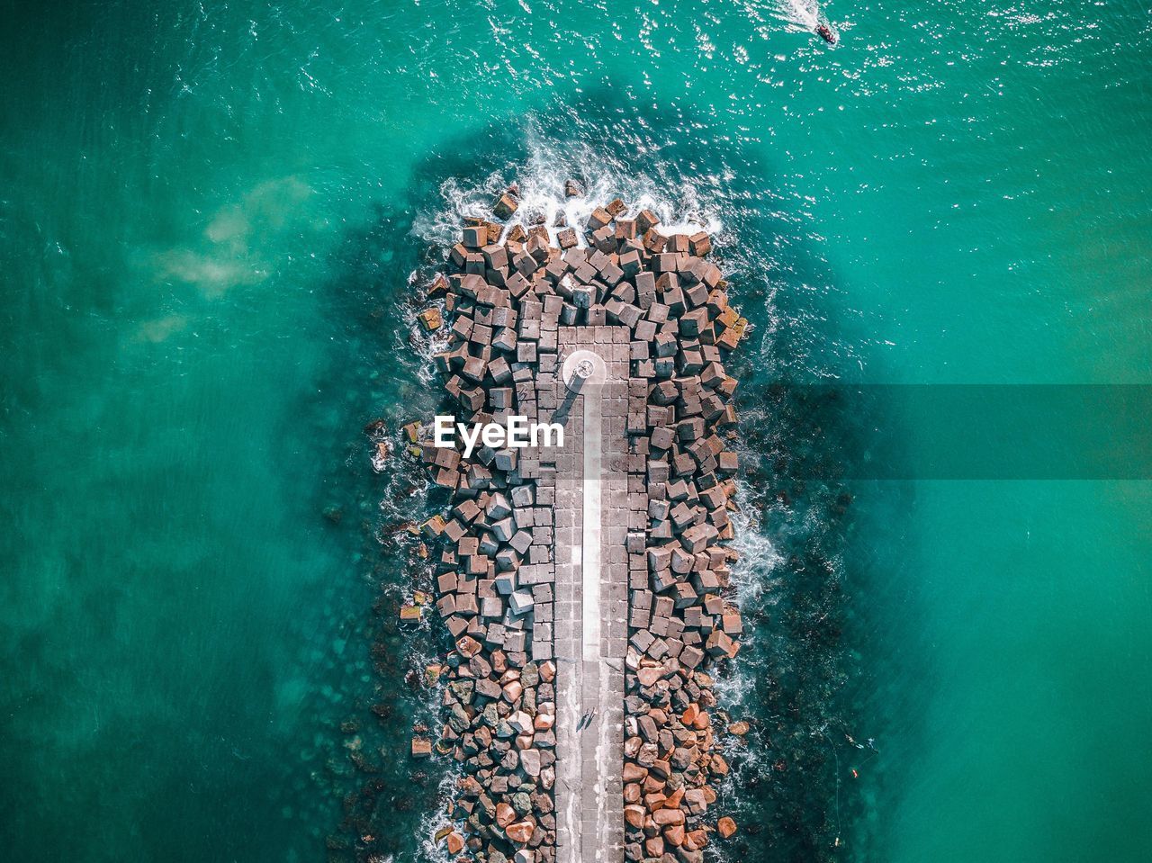 High angle view of stones in sea