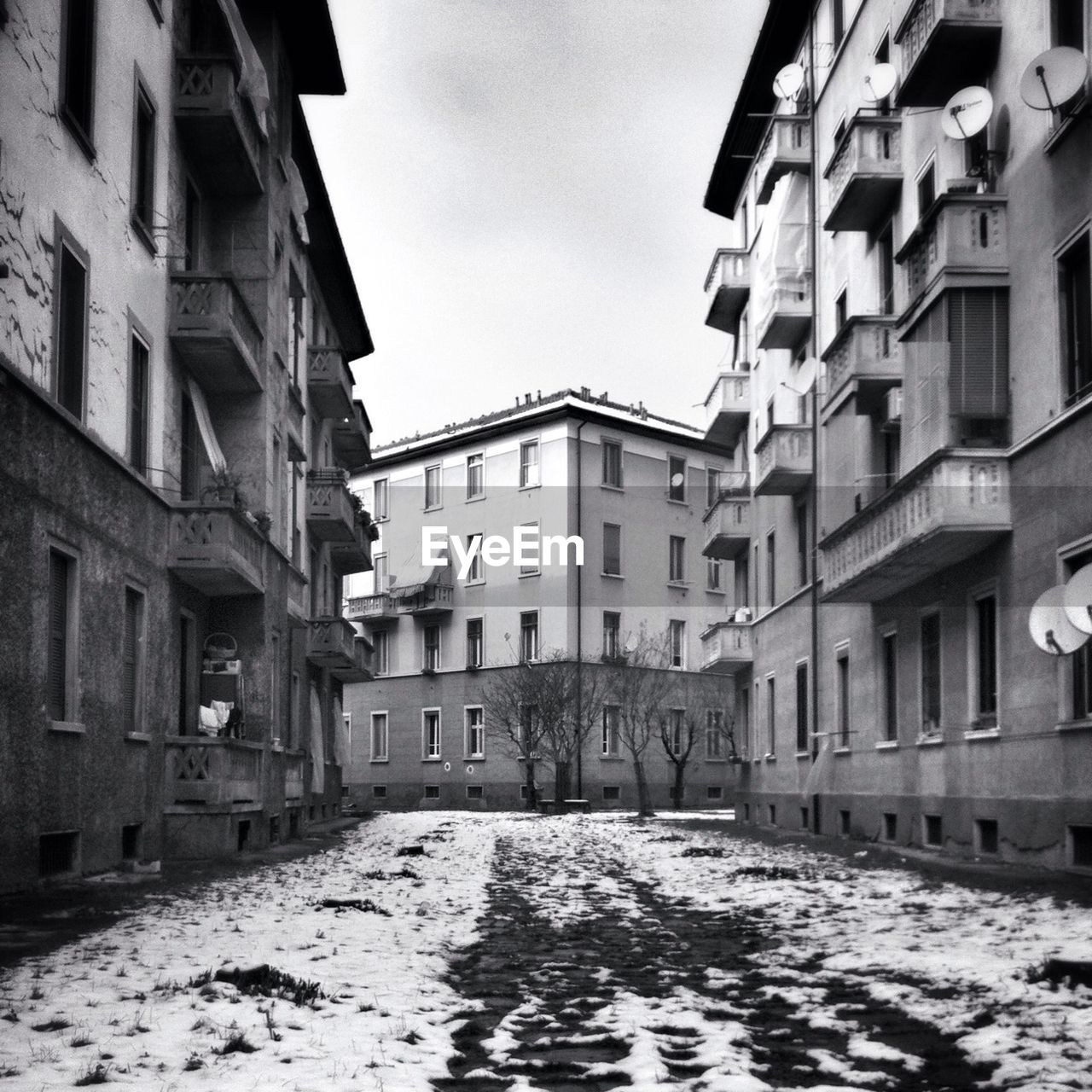 Alley along buildings in winter