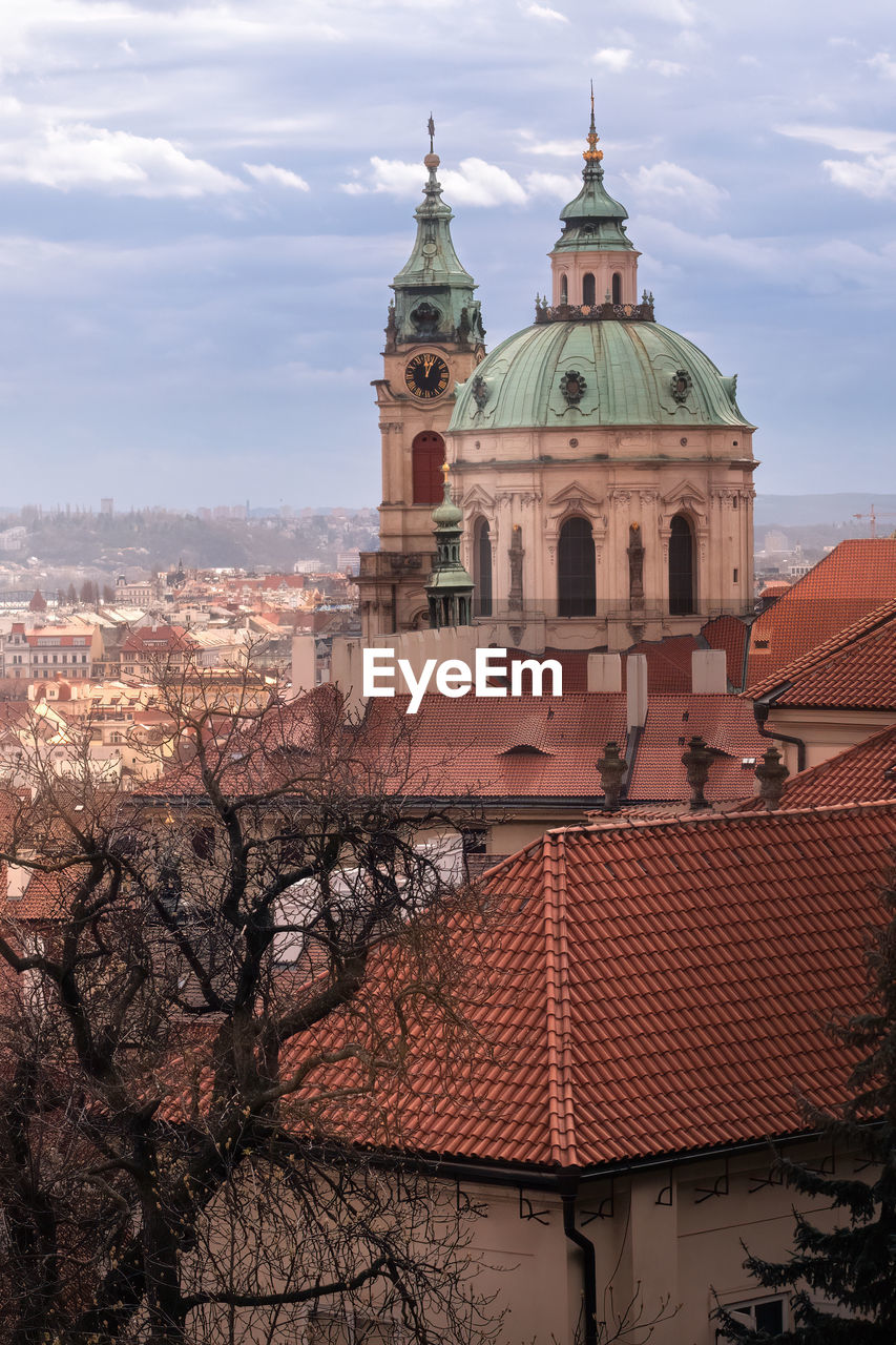 architecture, building exterior, built structure, dome, building, place of worship, sky, religion, travel destinations, city, belief, nature, spirituality, cloud, tree, landmark, tower, travel, history, worship, the past, roof, catholicism, no people, tourism, outdoors, plant, day, town, cityscape