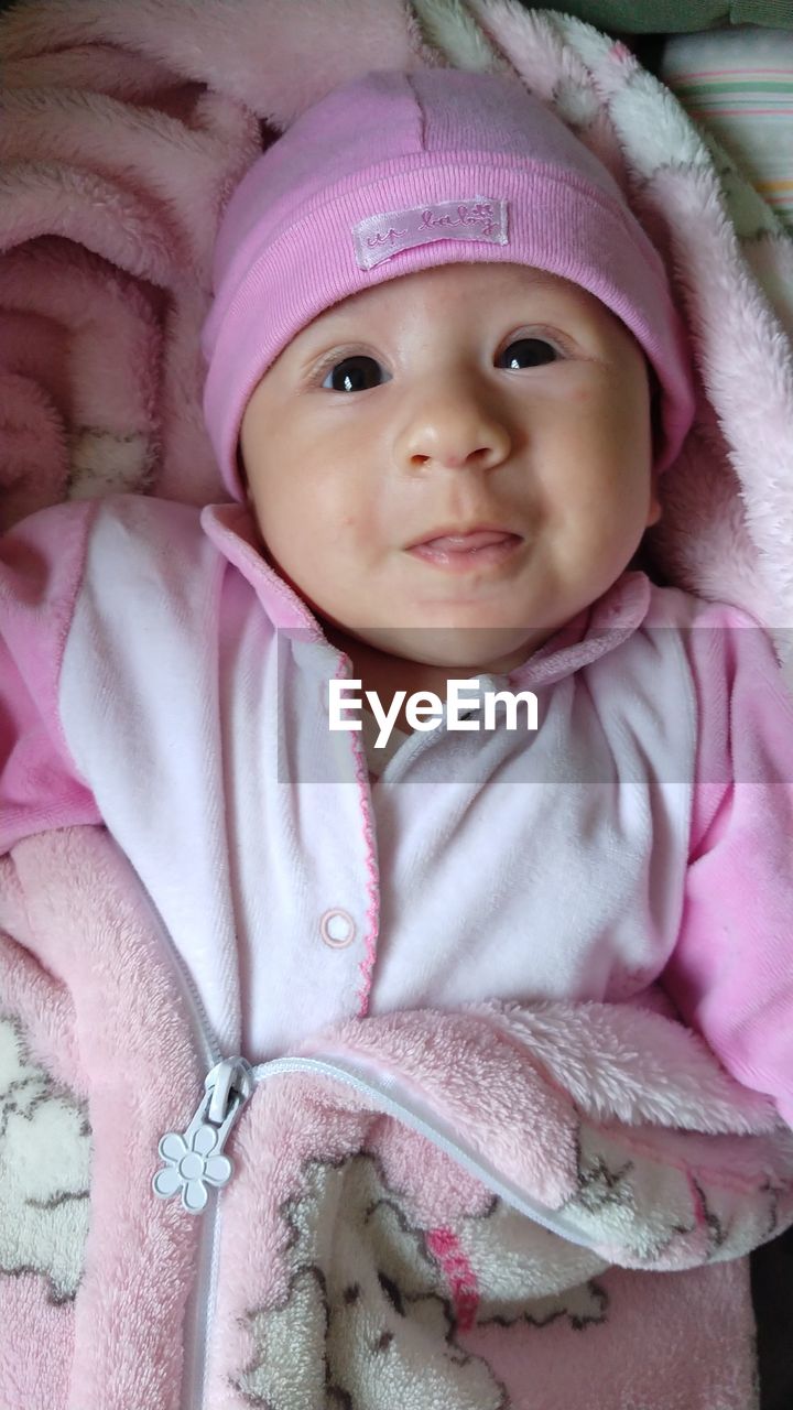 PORTRAIT OF CUTE BABY GIRL WITH PINK HAT