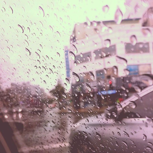 CLOSE-UP OF WATER DROPS ON WINDOW