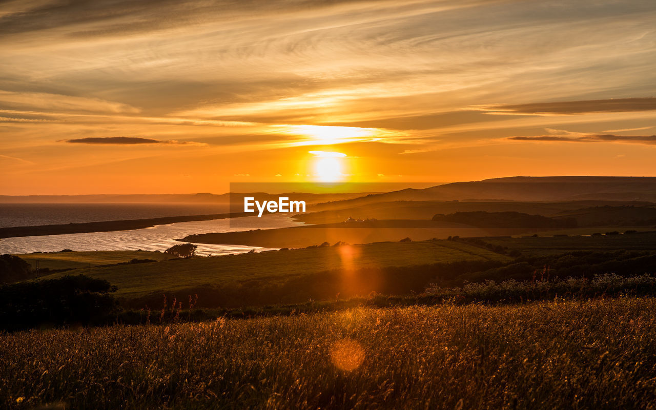 Sunset at sea barn farm, fleet, weymouth, uk