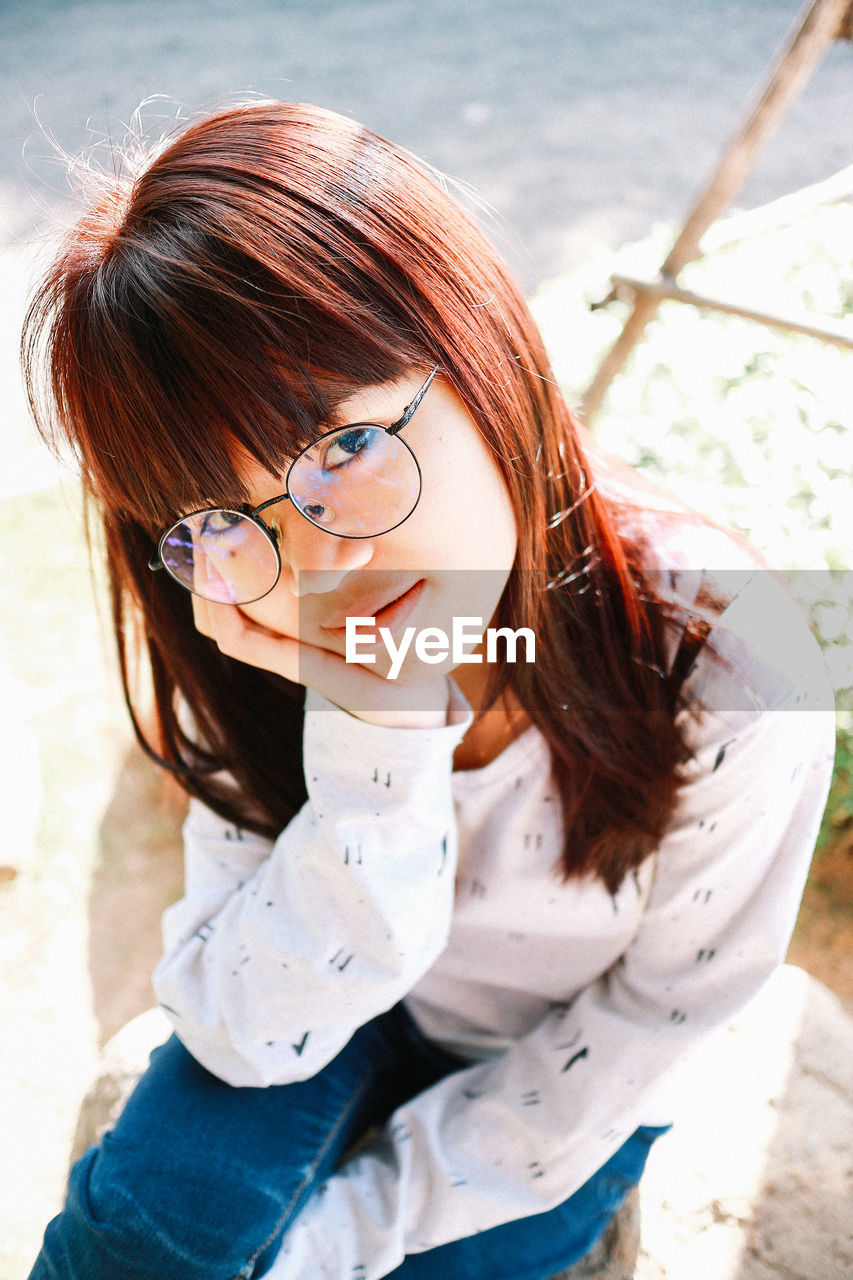 Portrait of young woman looking away