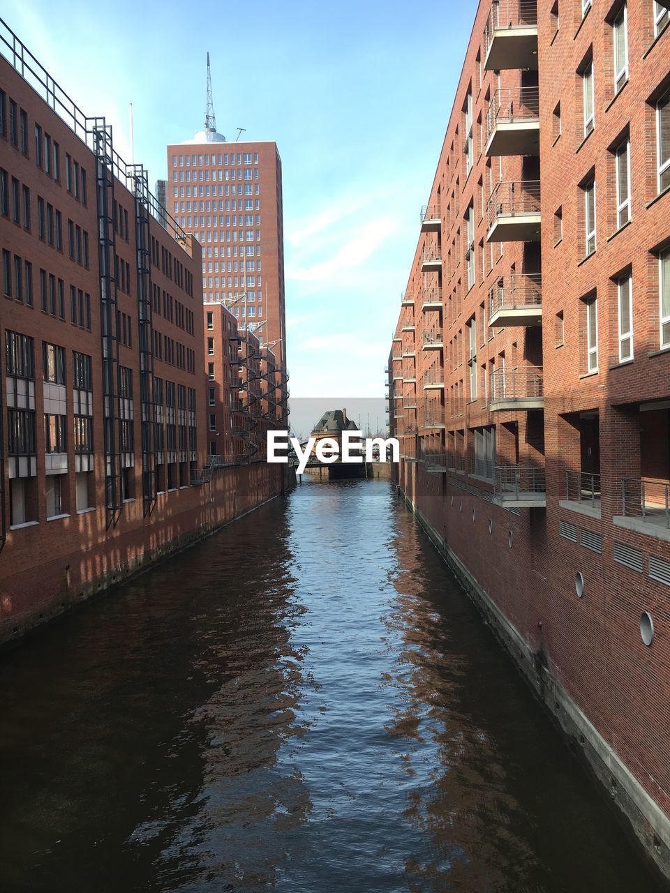 Canal amidst residential buildings