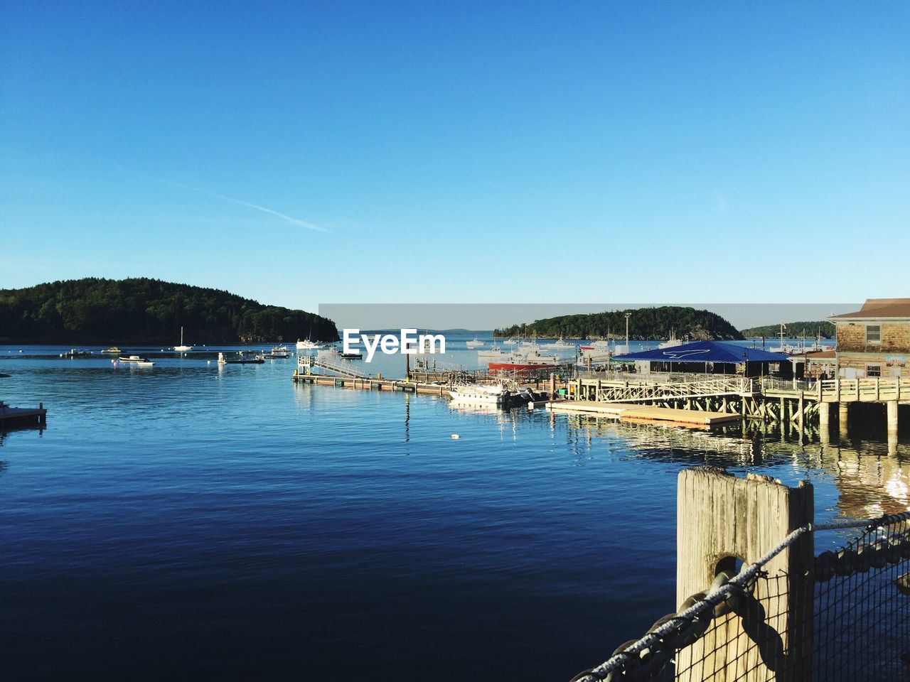 View of harbor against blue sky