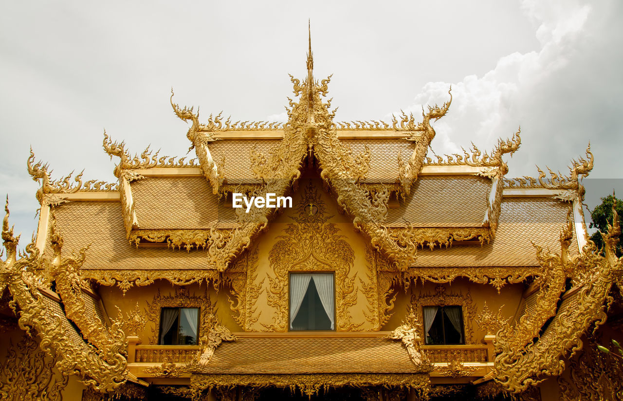 LOW ANGLE VIEW OF TEMPLE AGAINST BUILDING