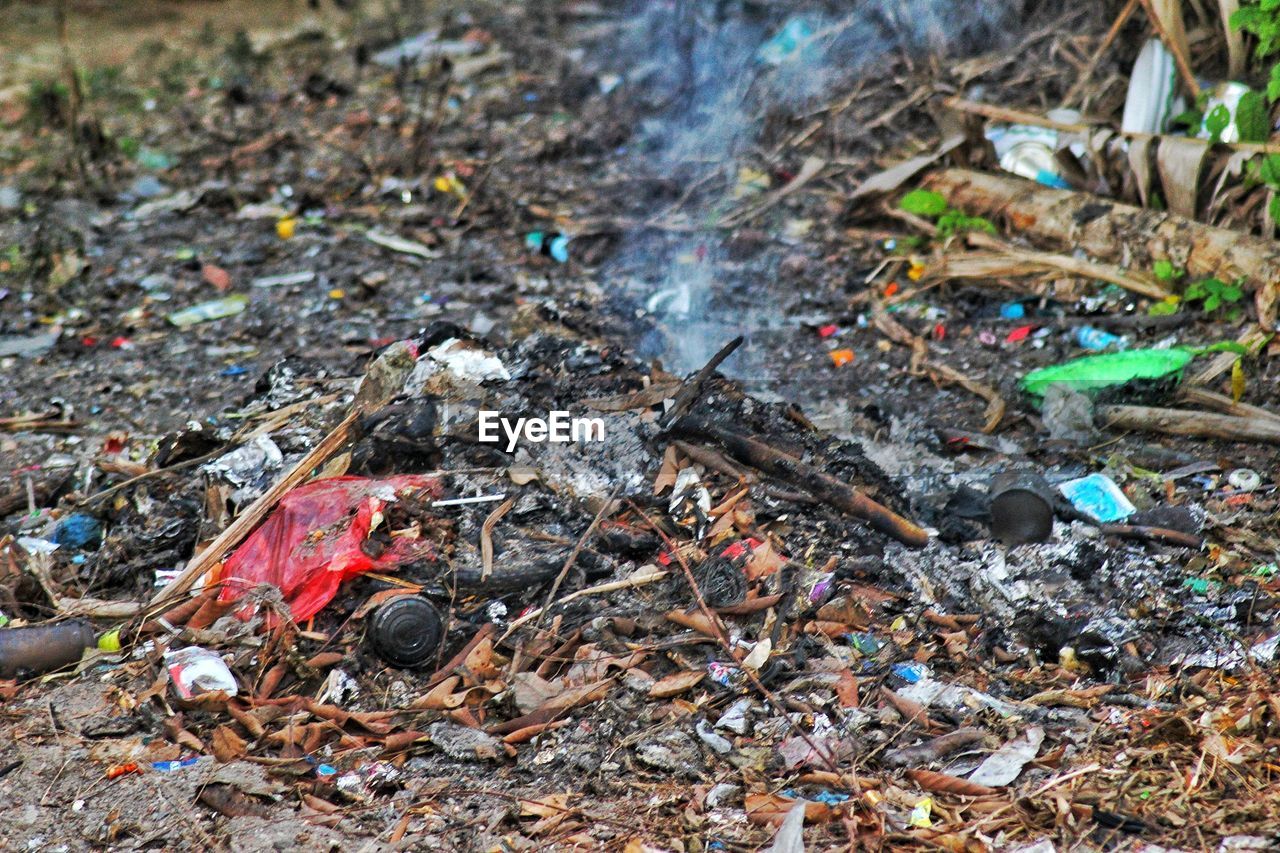CLOSE-UP HIGH ANGLE VIEW OF GARBAGE IN PARK