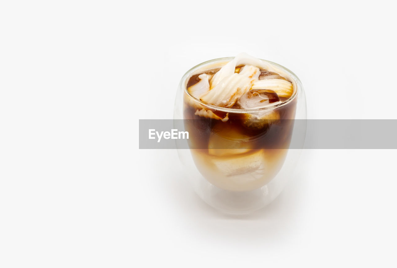 CLOSE-UP OF COFFEE ON WHITE BACKGROUND