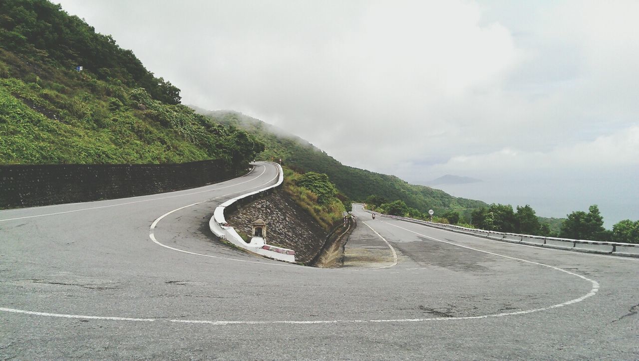 Surface level of curved road along landscape