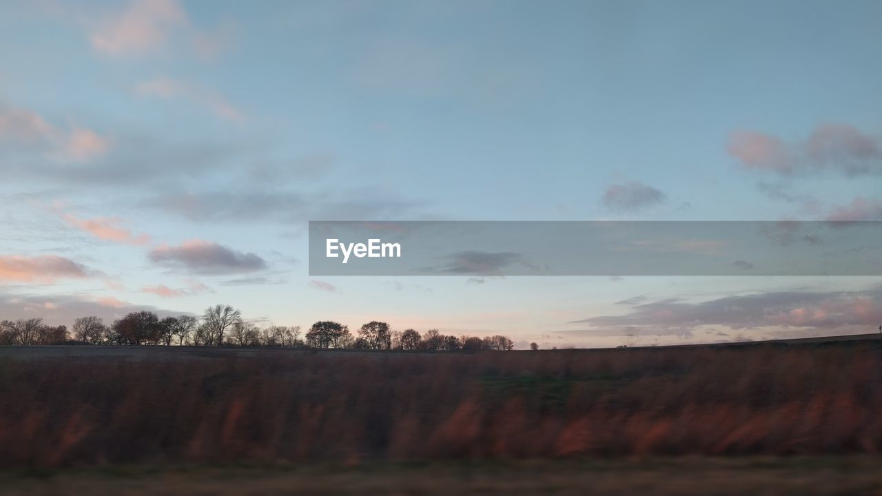 VIEW OF LANDSCAPE AGAINST CLOUDY SKY