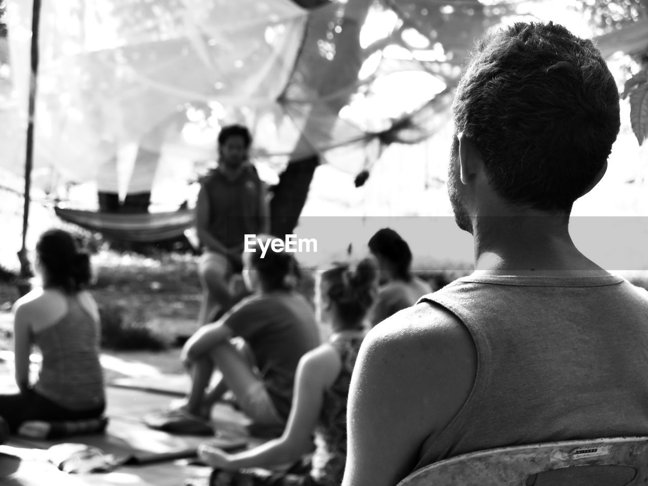 Close-up of man sitting outdoors