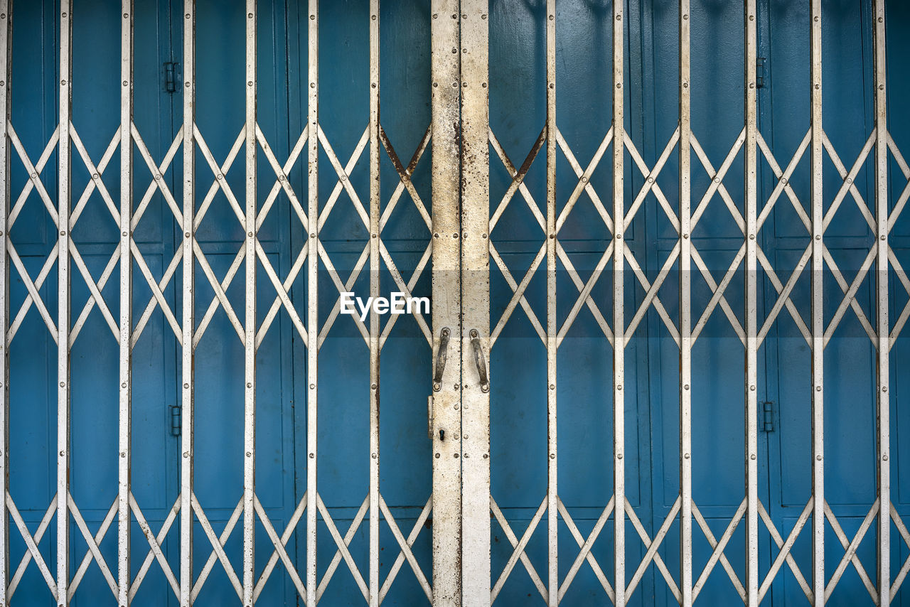 Full frame shot of closed metal gate