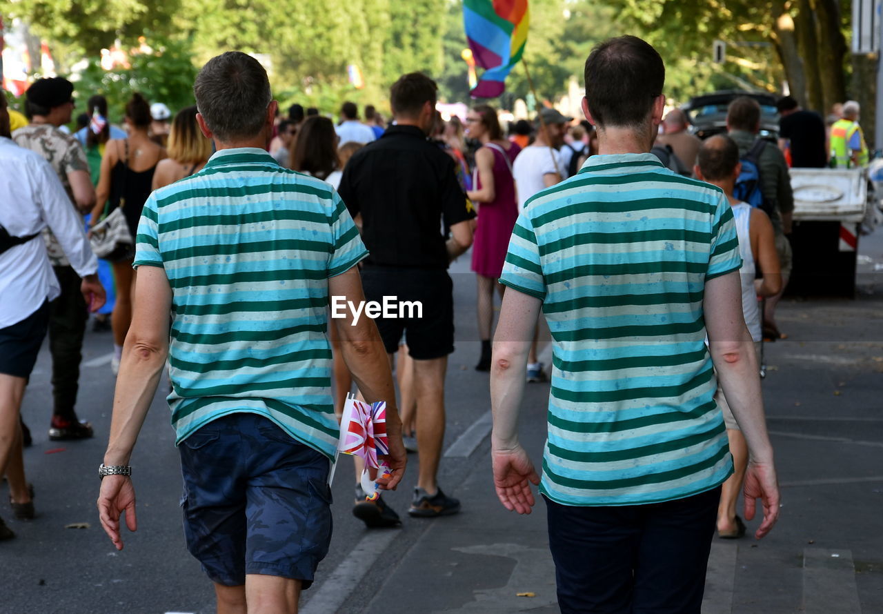 PEOPLE WALKING ON CITY STREET