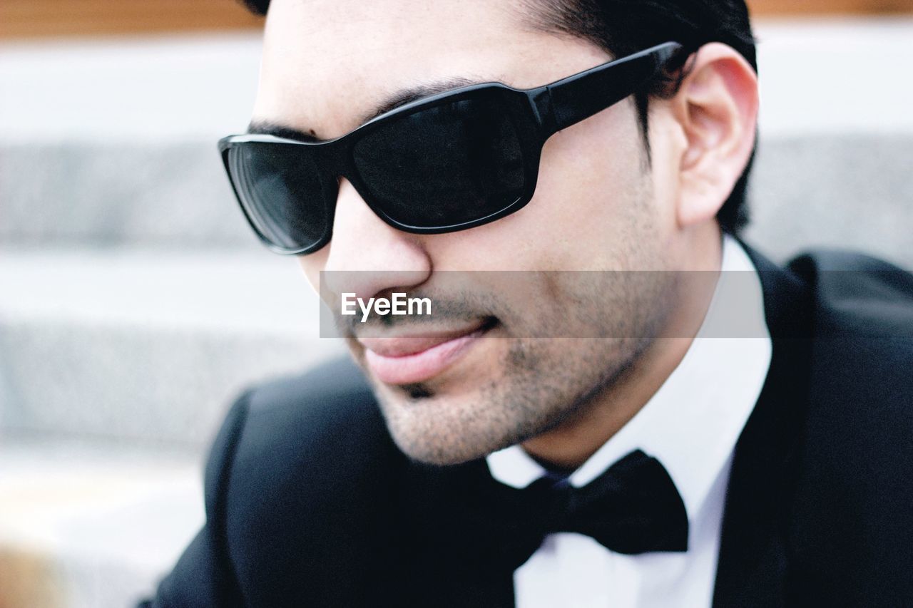 Close-up of young man in suit