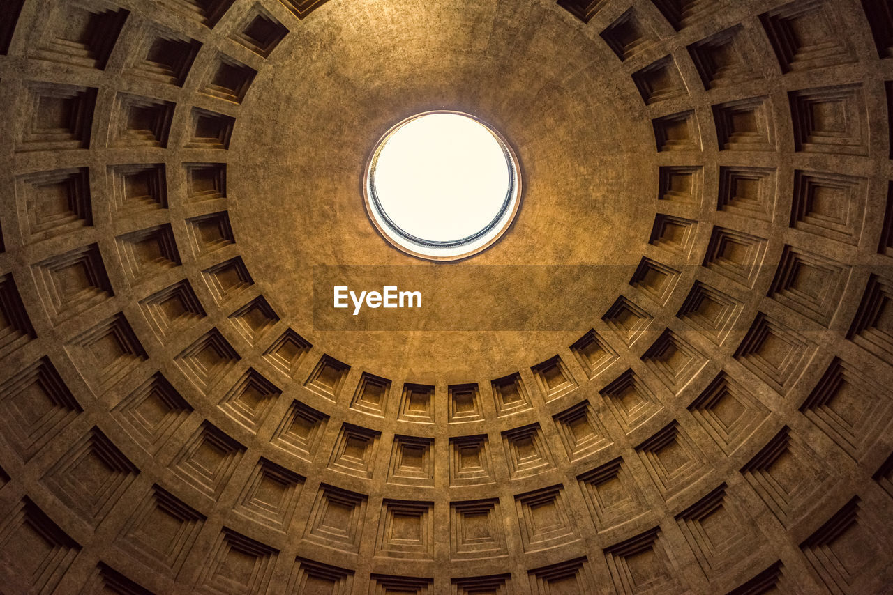 Upward picture of the amazing architecture ceiling of pantheon, important landmark of rome, italy