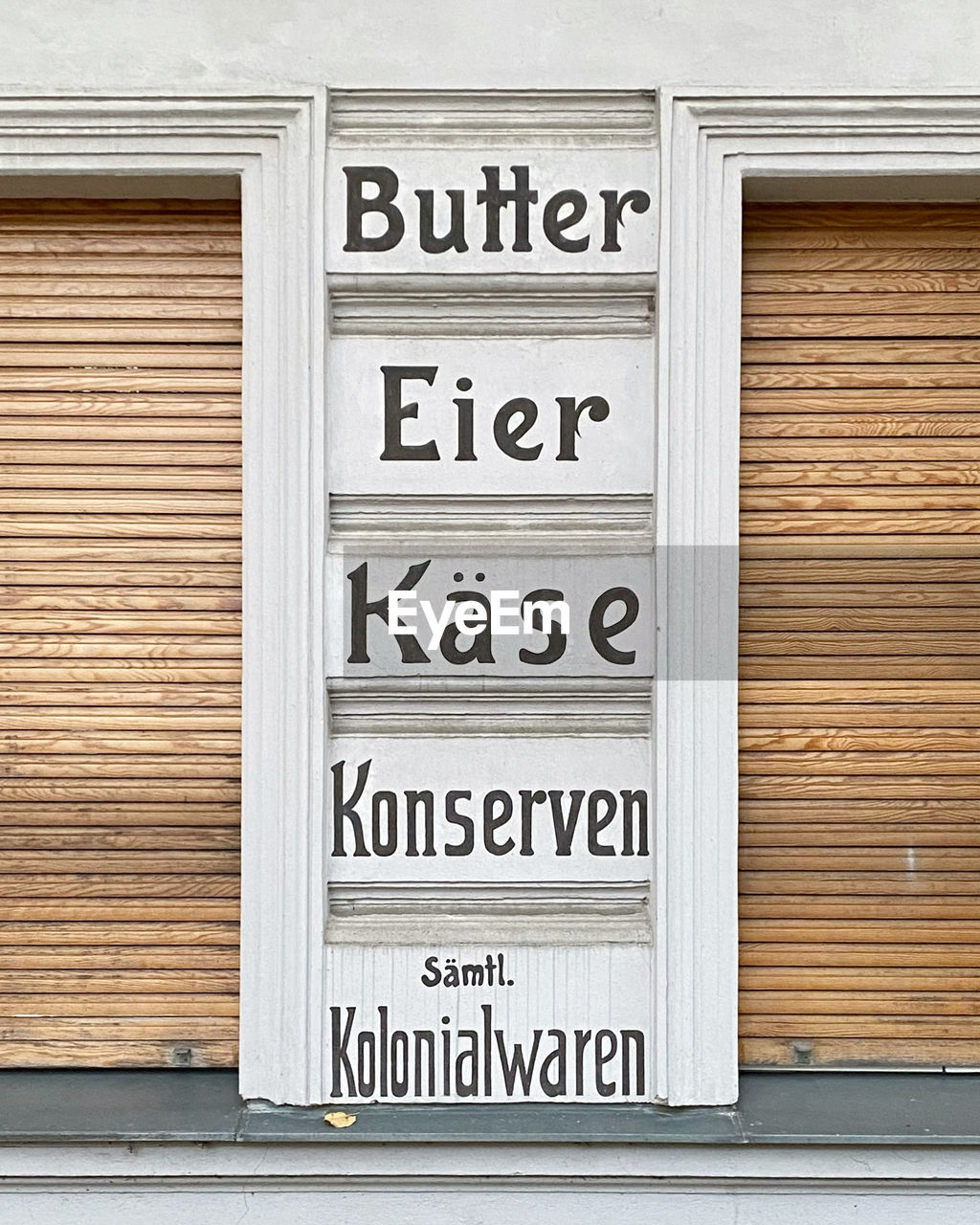 TEXT ON WOODEN DOOR OF BUILDING