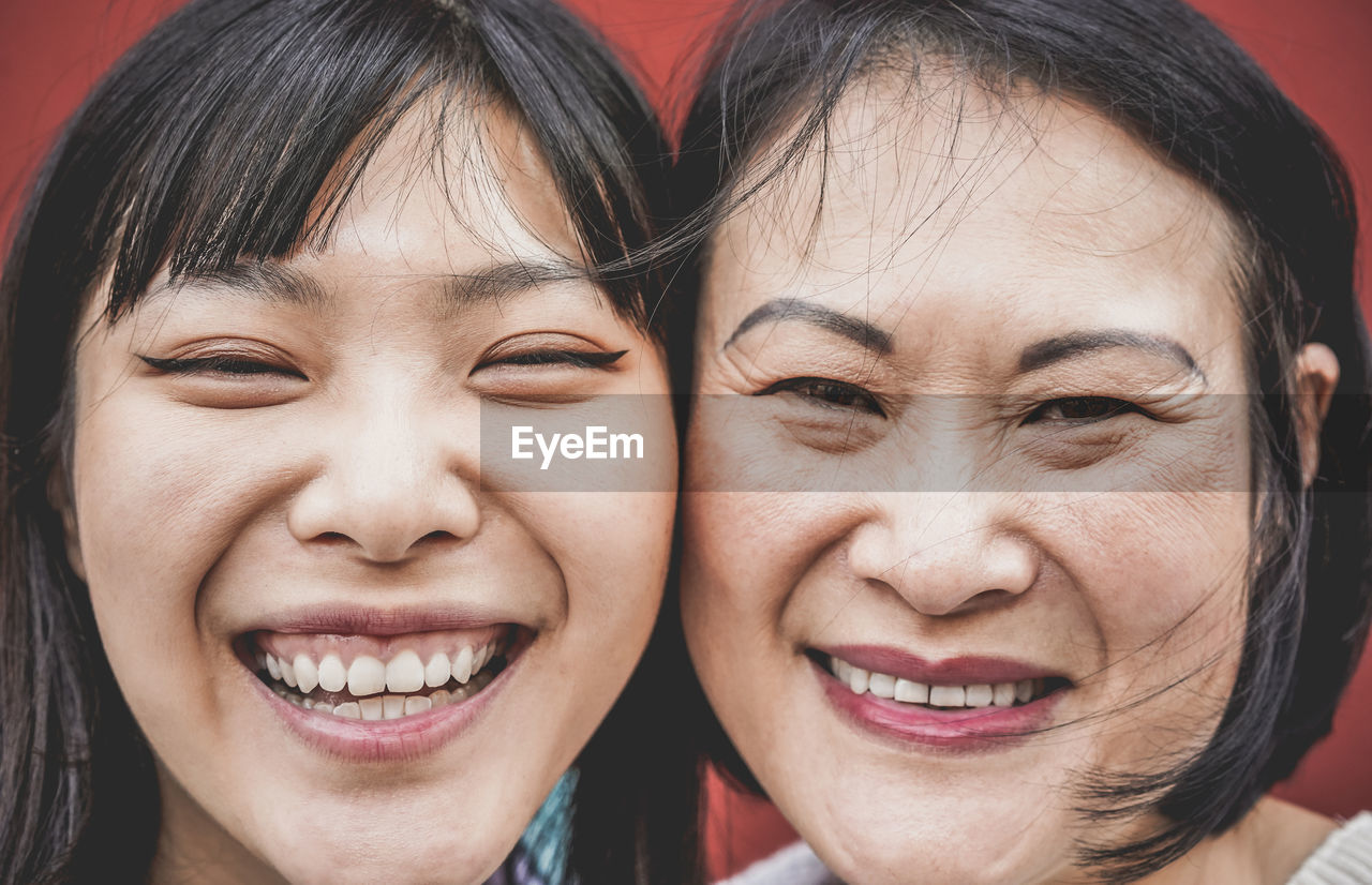 Close-up portrait happy woman with mother 