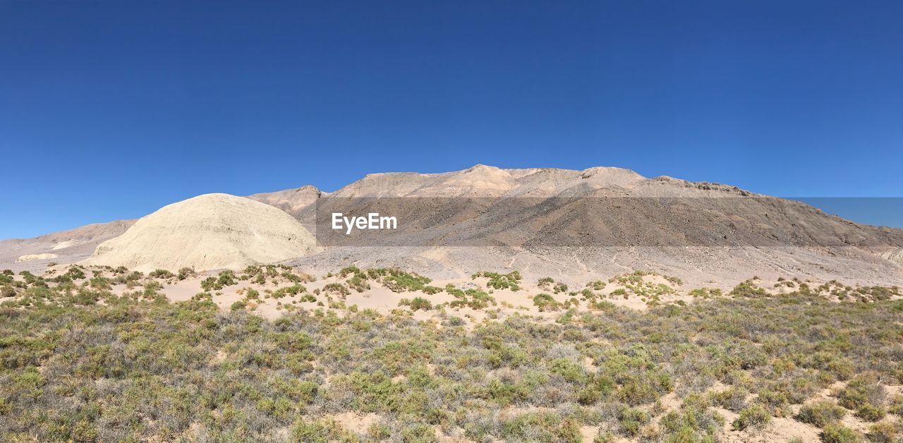 SCENIC VIEW OF MOUNTAIN AGAINST CLEAR SKY