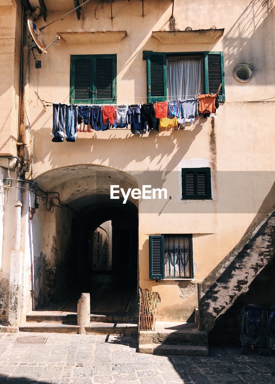 CLOTHES DRYING OUTSIDE BUILDING