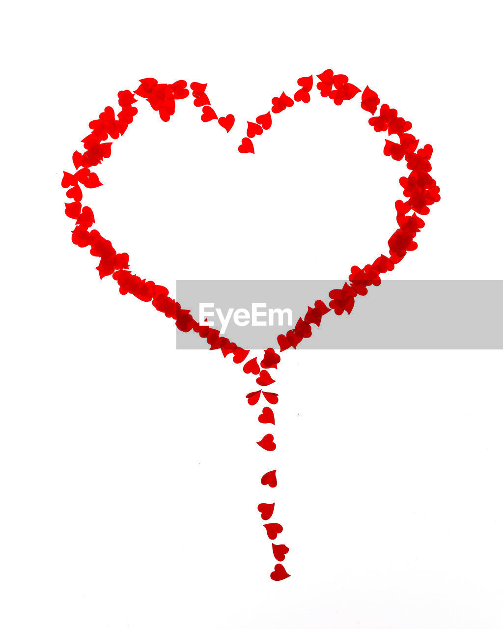 Close-up of red heart shapes over white background