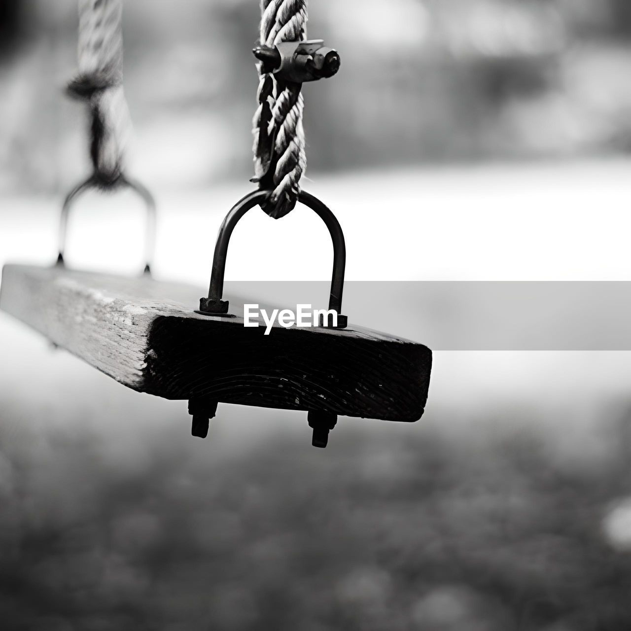 black, black and white, hanging, white, monochrome, monochrome photography, focus on foreground, chain, metal, no people, light, iron, outdoors, close-up, day, playground, nature, lighting