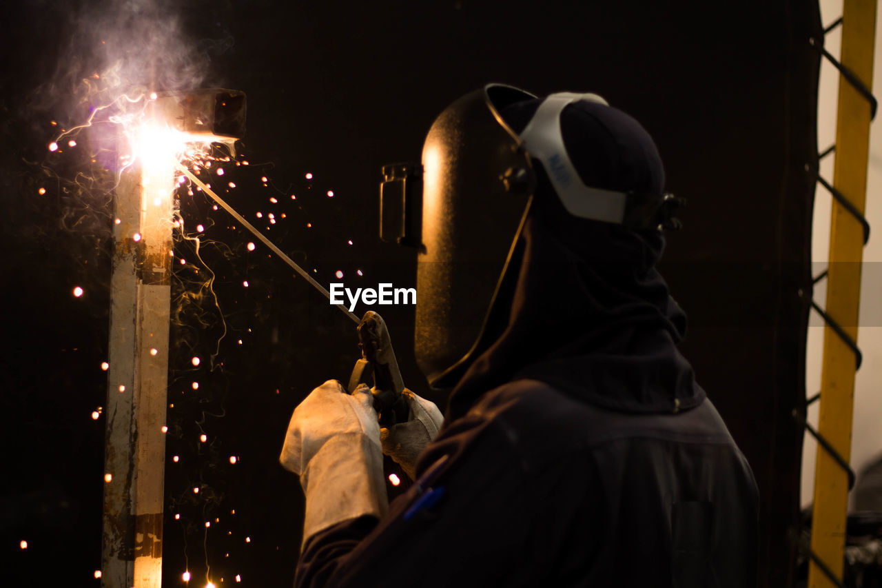 Man working on metal in workshop