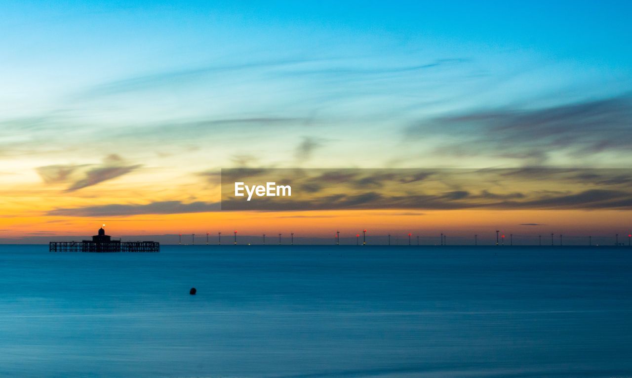 SCENIC VIEW OF SEA DURING SUNSET