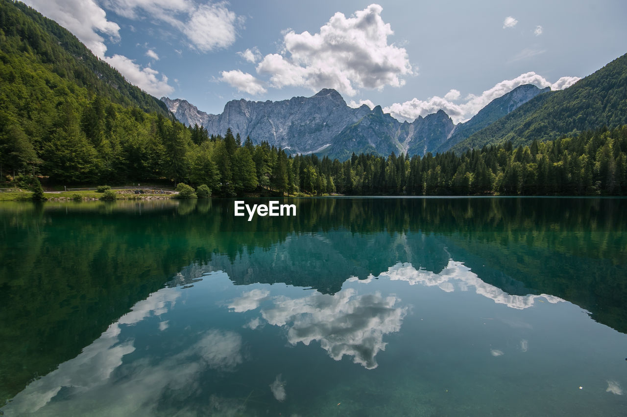 Scenic view of lake and mountains against sky