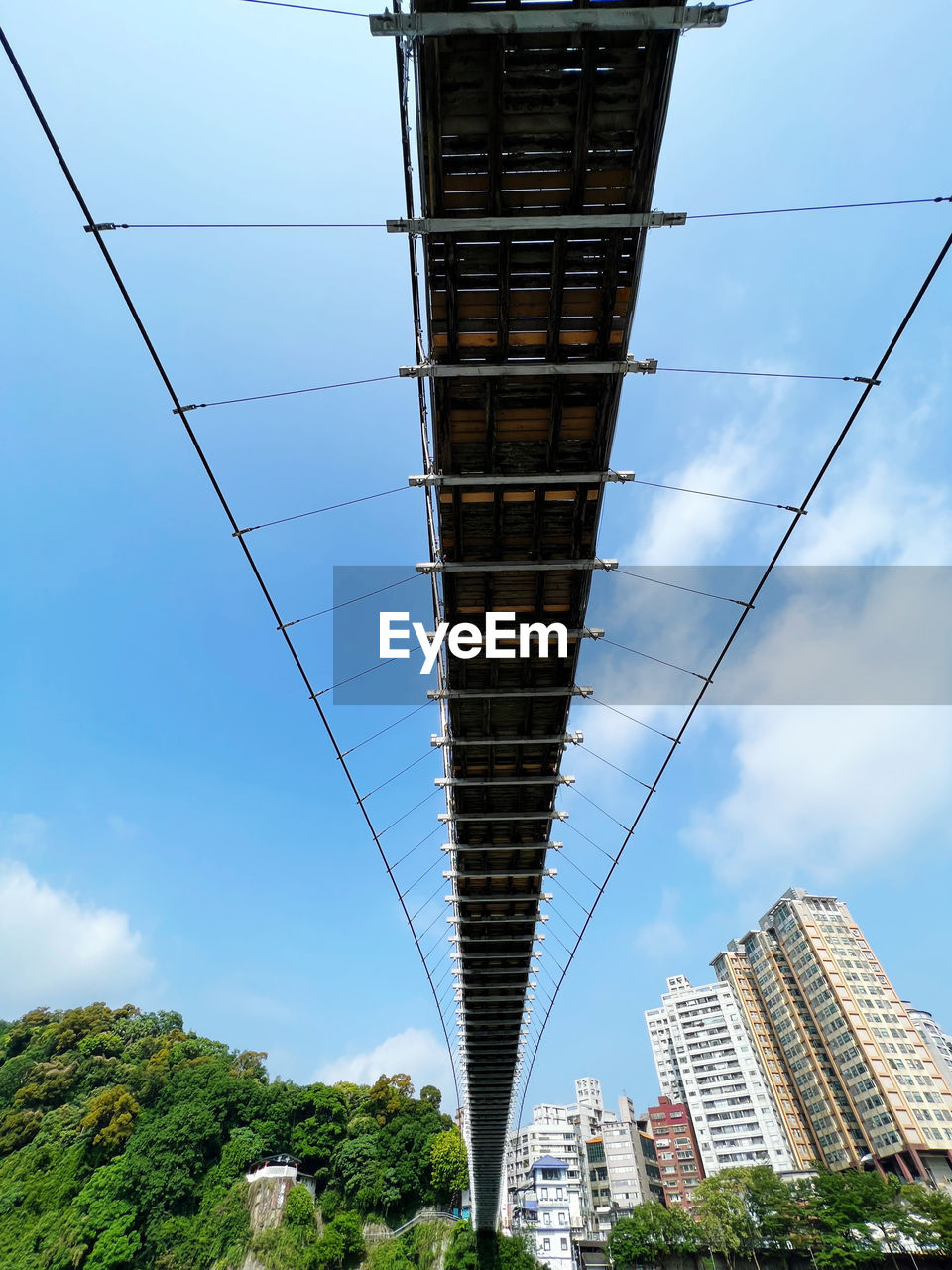 architecture, built structure, city, sky, building exterior, skyscraper, landmark, building, tower, nature, office building exterior, tower block, no people, cloud, day, low angle view, cable, transportation, cityscape, outdoors, blue, bridge, tree, travel destinations, residential district, plant, landscape, urban area, travel, street, city life, office, road
