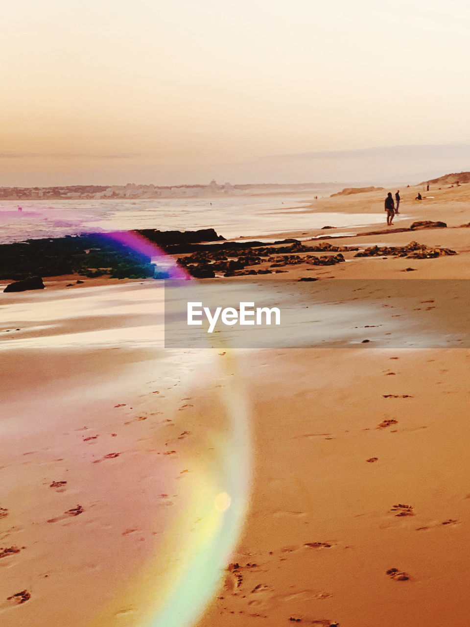 SCENIC VIEW OF BEACH DURING SUNSET