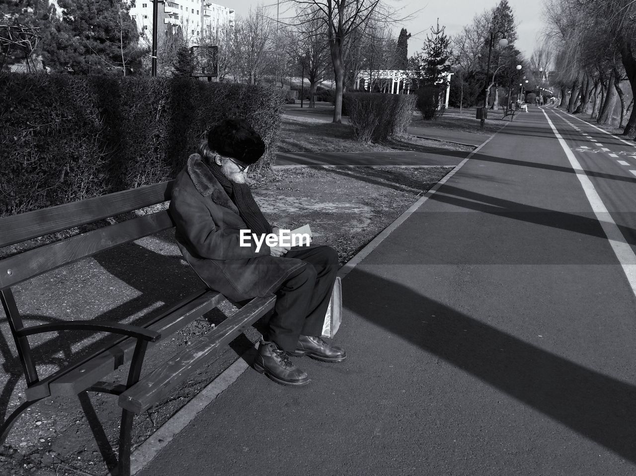 WOMAN SITTING ON BENCH