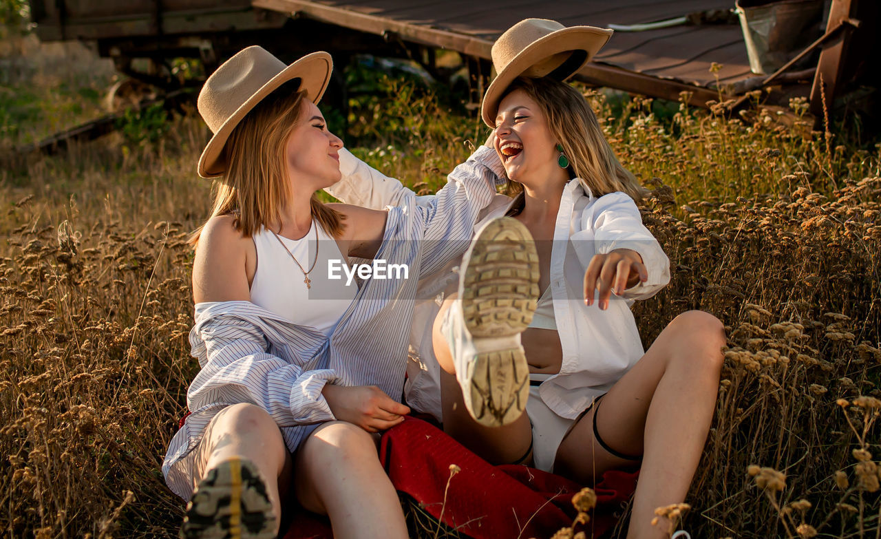 Friends sitting on field