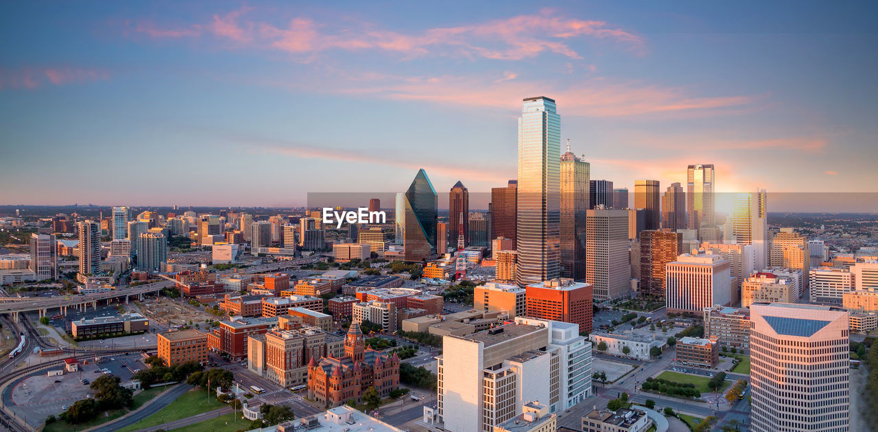 MODERN BUILDINGS IN CITY AGAINST SKY