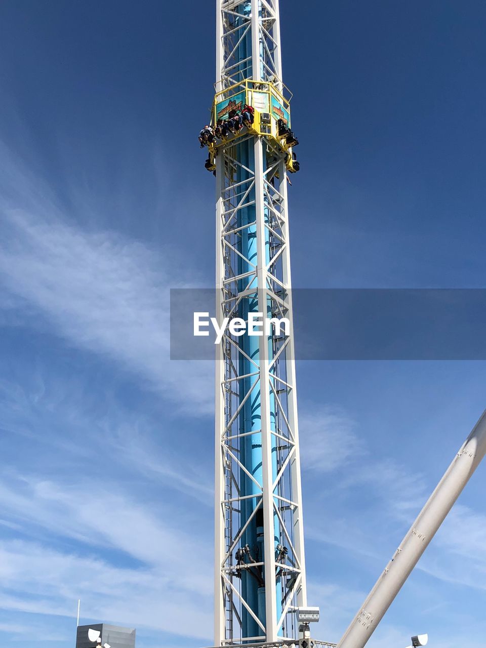 Low angle view of amusement park ride against sky