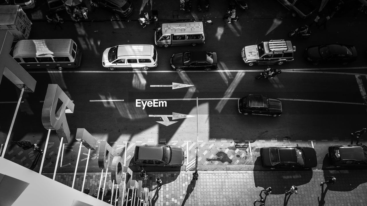 High angle view of vehicles parked on street in city