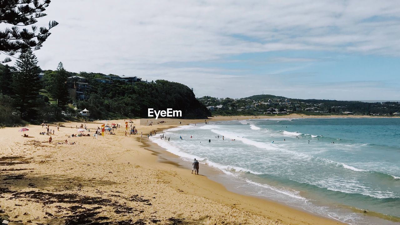 PANORAMIC VIEW OF BEACH AGAINST SKY