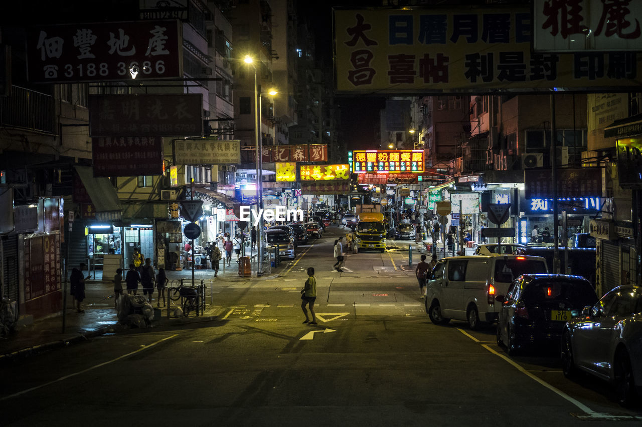 CARS ON STREET AT NIGHT