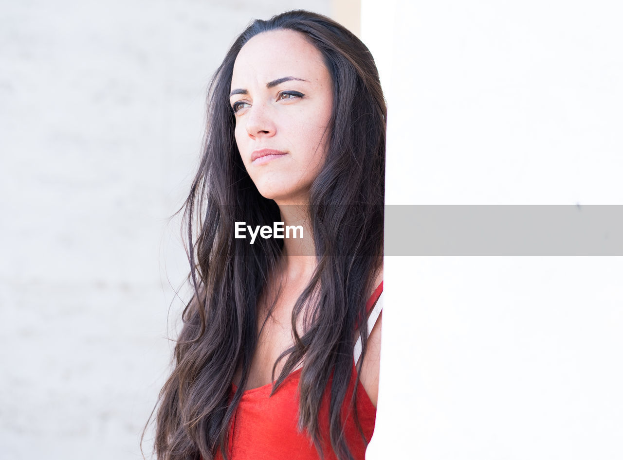 Thoughtful woman with long hair